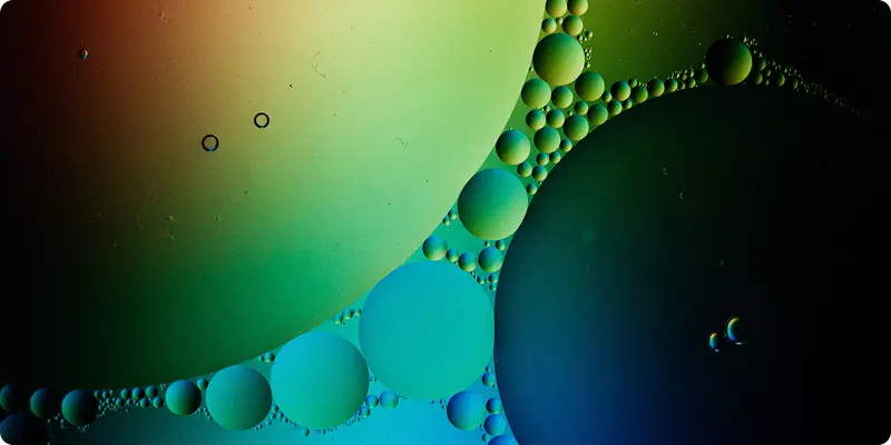 Abstract microscopic view of colorful oil bubbles representing quantum dots